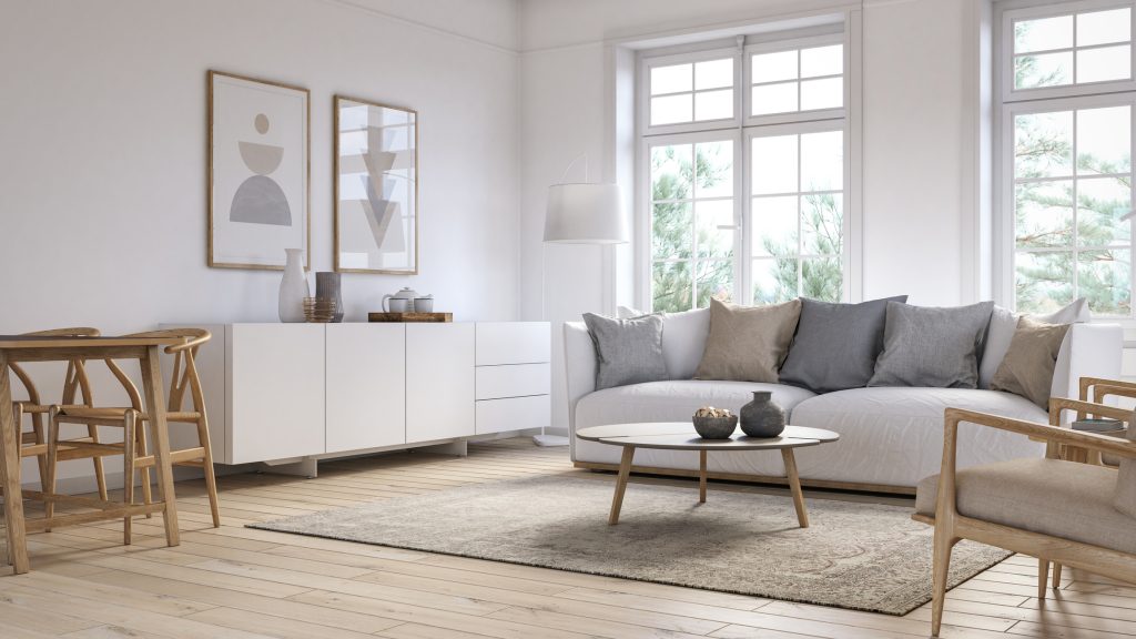 Salón con muebles de color blanco, alfombra y elementos de madera.